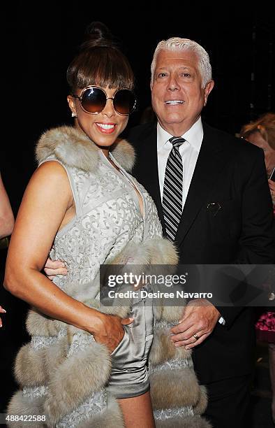 Marjorie Harvey and designer Dennis Basso attend Dennis Basso Front Row & Backstage Spring 2016 New York Fashion Week: The Shows at The Arc, Skylight...