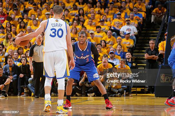 Chris Paul of the Los Angeles Clippers guards Stephen Curry of the Golden State Warriors in Game Four of the Western Conference Quarterfinals during...