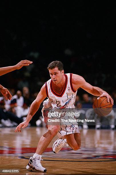Matt Maloney of the Houston Rockets moves the ball during the game against the Los Angeles Clippers on January 27, 1998 at Compaq Center in Houston,...