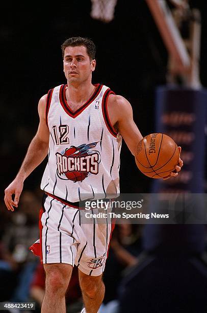 Matt Maloney of the Houston Rockets brings the ball up court during the game against the Los Angeles Clippers on January 27, 1998 at Compaq Center in...
