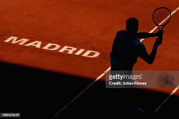 Jerzy Janowicz of Poland in action against Ernests Gulbis of Latvia during day four of the Mutua Madrid Open tennis tournament at the Caja Magica on...
