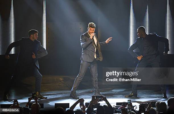 Recording artist Ricky Martin performs as he kicks off his One World Tour in support of the album "A Quien Quiera Escuchar" at Axis at Planet...