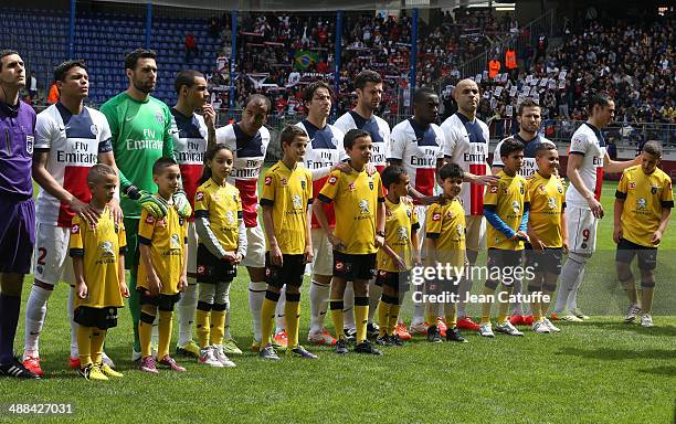 Team PSG poses prior to the french Ligue 1 match between FC Sochaux Montbeliard and Paris Saint-Germain FC at Stade Bonal on April 27, 2014 in...