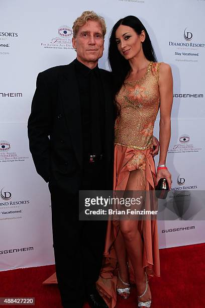 Robert Huizenga and Regina Salpagarova at The Brent Shapiro Foundation's Summer Spectacular on September 12, 2015 in Beverly Hills, California.