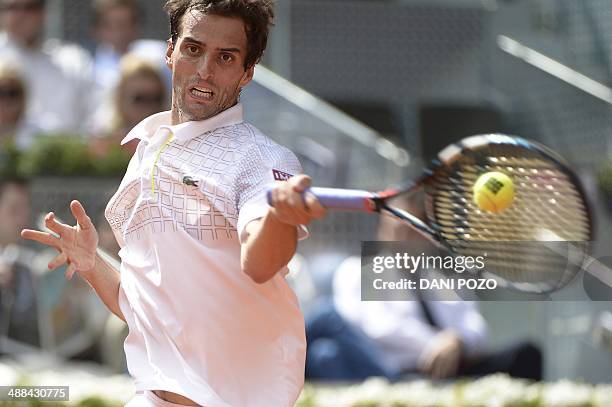 Spanish player Albert Ramos returns the ball to Spanish player David Ferrer during their men's singles second round tennis match of the Madrid...