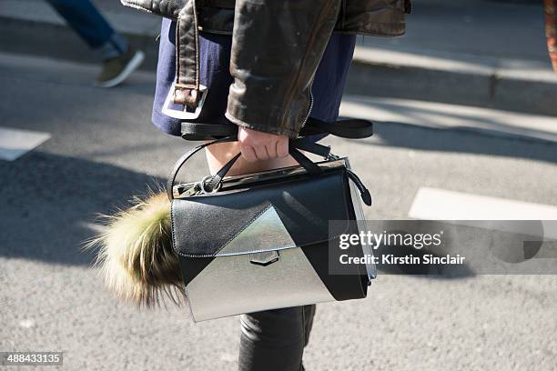 Model Ming Xi wears a vintage Harley Davidson jacket, Fendi Monster Pom Pom and bag on day 6 of Paris Collections: Women on March 02, 2014 in Paris,...