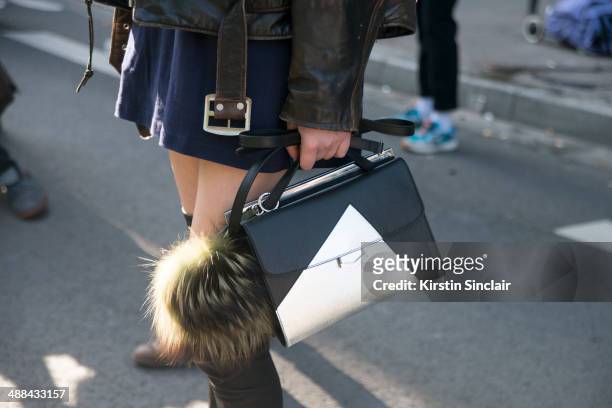 Model Ming Xi wears a vintage Harley Davidson jacket, Fendi Monster Pom Pom and bag on day 6 of Paris Collections: Women on March 02, 2014 in Paris,...