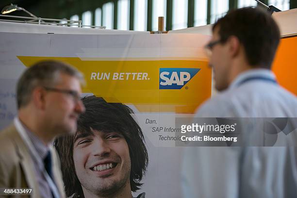 The logo of SAP AG sits on a sign on the software company's stand at the Connecticum job fair for students, graduates and young professionals at...