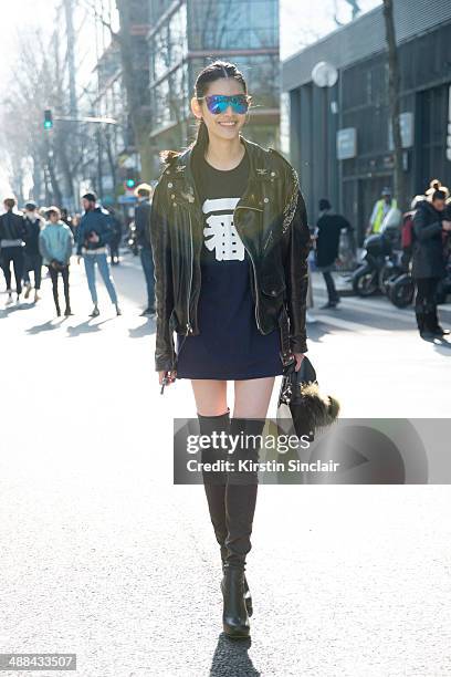 Model Ming Xi wears a vintage Harley Davidson jacket, Fendi Monster Pom Pom and bag and Phillip Lim sunglasses on day 6 of Paris Collections: Women...