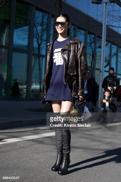 Model Ming Xi wears a vintage Harley Davidson jacket, Fendi Monster Pom Pom and bag and Phillip Lim sunglasses on day 6 of Paris Collections: Women...