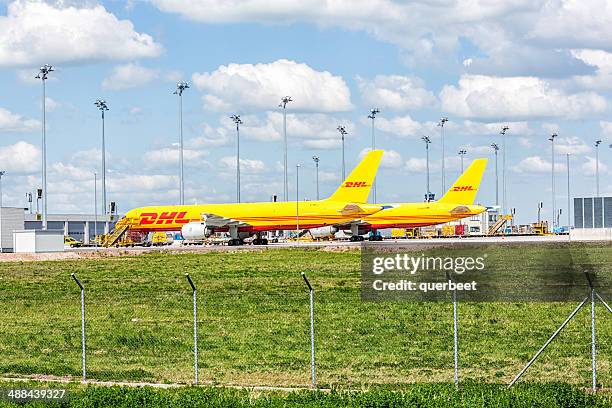 dhl aircraft at leipzig airport - cargo planes at leipzig airport stock pictures, royalty-free photos & images