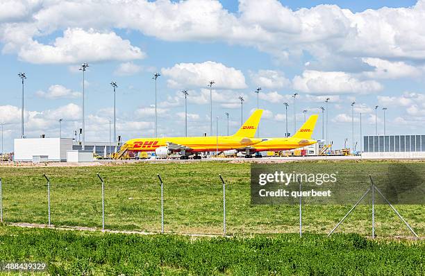 dhl aircraft at leipzig airport - cargo planes at leipzig airport stock pictures, royalty-free photos & images