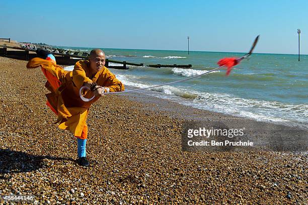 Shaolin monk practices on the beach on September 10, 2015 in Bognor Regis, England. The Shaolin Monks have travelled from their temple in the...