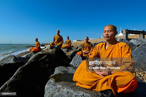 Monks meditate on the beach on September 10, 2015 in Bognor Regis, England. The Shaolin Monks have travelled from their temple in the foothills of...