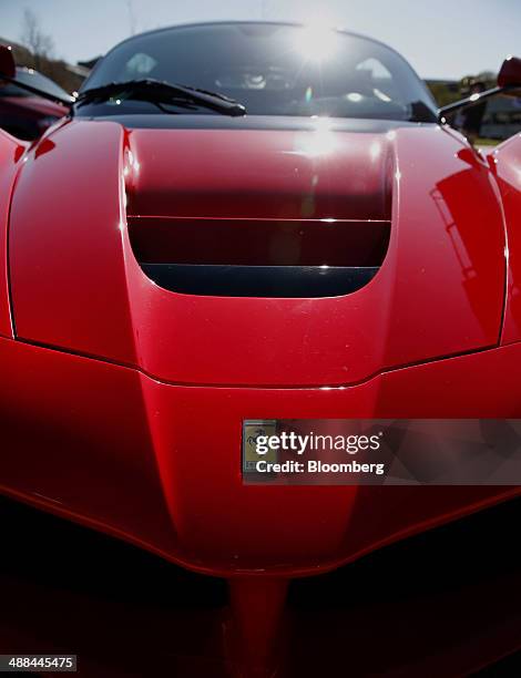 Ferrari SpA LaFerrari vehicle stands in front of the Chrysler Group LLC headquarters in Auburn Hills, Michigan, U.S., on Tuesday, May 6, 2014. Fiat...