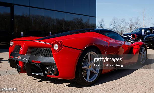 Ferrari SpA LaFerrari vehicle stands in front of the Chrysler Group LLC headquarters in Auburn Hills, Michigan, U.S., on Tuesday, May 6, 2014. Fiat...