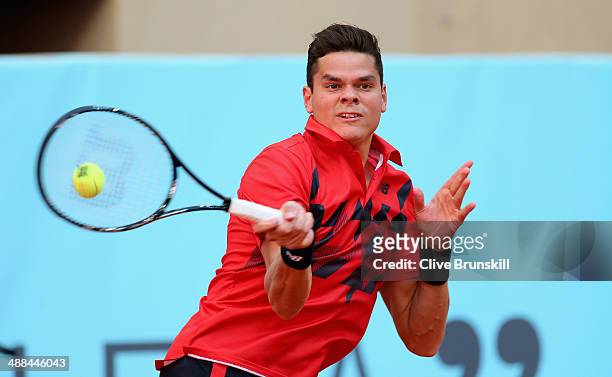 Milos Raonic of Canada plays a forehand against Jeremy Chardy of France in their second round match during day four of the Mutua Madrid Open tennis...
