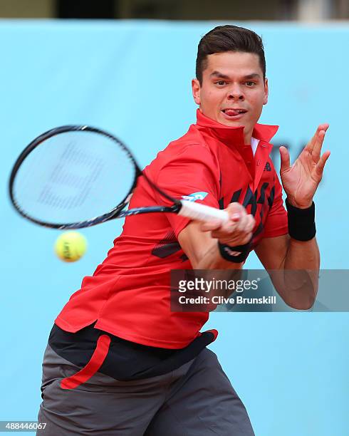 Milos Raonic of Canada plays a forehand against Jeremy Chardy of France in their second round match during day four of the Mutua Madrid Open tennis...