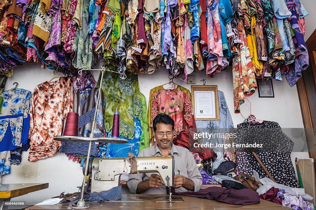 Men working in a tailor shop. Bandar Seri Bengawan, Brunei,...