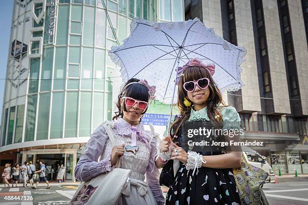 Girls dressed as Lolitas walking on the streets of Tokyo. Japan, Asia.