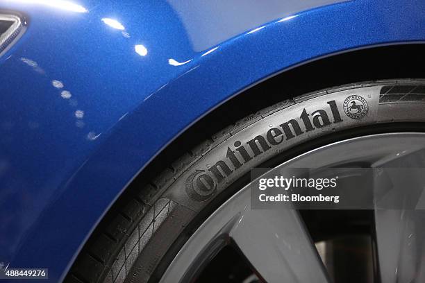 Continental AG tire sits on a wheel of a Tesla Model S electric automobile, produced by Tesla Motors Inc., at the IAA Frankfurt Motor Show in...