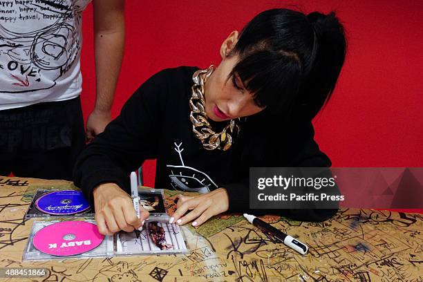 The Italian woman rapper Claudia Nahum, also known as "Baby K", signs the autograph of her new album "Kiss Kiss Bang Bang", preceded by the single...