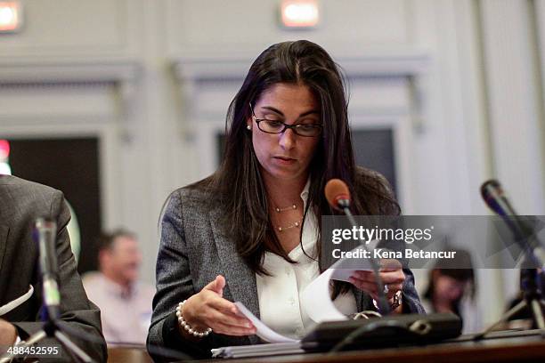 Former aide to New Jersey Gov. Chris Christie, Christina Renna , looks at papers as she testifies during a hearing by the New Jersey Legislature's...