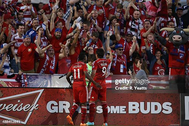 David Texeira celebrates with his teammate Fabian Castillo of FC Dallas after scoring a goal against the Seattle Sounders FC at Toyota Stadium on...