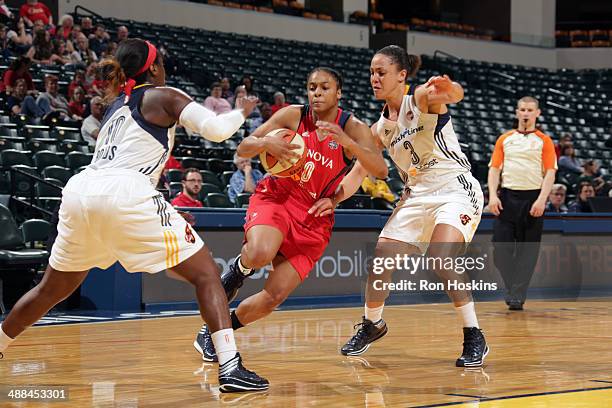 Dia Mathies of the Washington Mystics handles the ball against the Indiana Fever during the WNBA pre-season game on May 6, 2014 at Bankers Life...