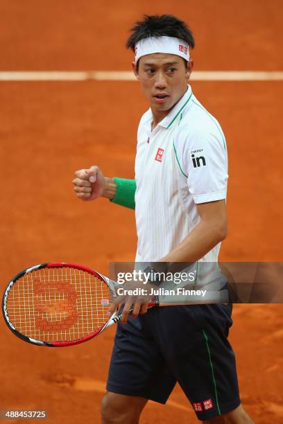 Kei Nishikori of Japan celebrates defeating Guillermo Garcia-Lopez of Spain during day four of the Mutua Madrid Open tennis tournament at the Caja...