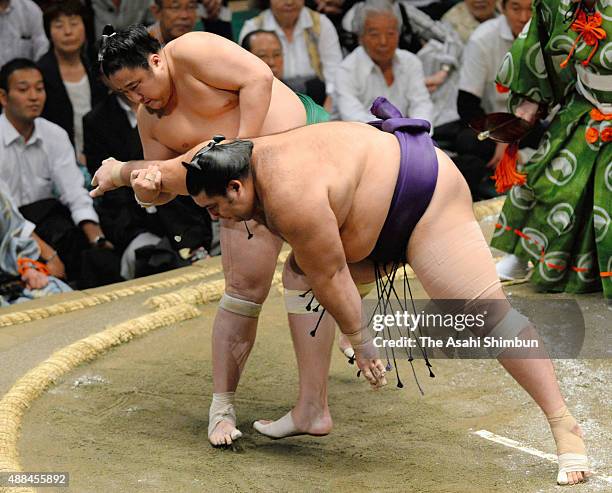 Sadanoumi throws Brazilian wrestler Kaisei to win during day four of the Grand Sumo Autumn Tournament at Ryogoku Kokugikan on September 16, 2015 in...