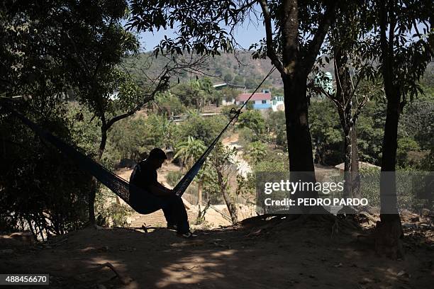 Relative of Leonel Castro, one of the 43 missing students, sits on a hammock at homein Los Magueyitos village, in Tecoanapa, Guerrero State, Mexico,...