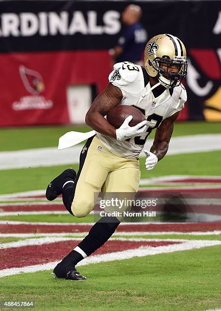 Marcus Murphy of the New Orleans Saints runs the ball during pregame against the Arizona Cardinals at University of Phoenix Stadium on September 13,...