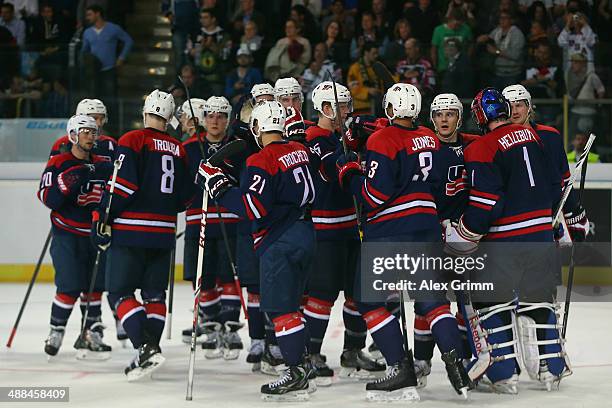 Goalkeeper Connor Hellebuyck of USA celebrates with team mates after the international ice hockey friendly match between Germany and USA at Arena...