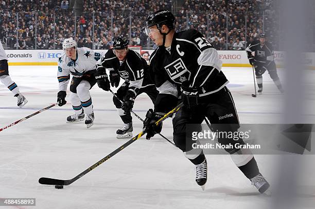 Dustin Brown of the Los Angeles Kings skates with the puck against the San Jose Sharks in Game Six of the First Round of the 2014 Stanley Cup...