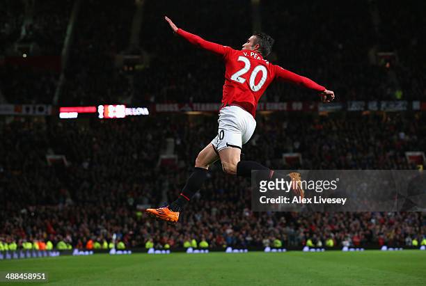 Robin van Persie of Manchester United celebrates scoring his team's third goal during the Barclays Premier League match between Manchester United and...