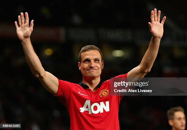 Nemanja Vidic of Manchester United salutes the fans after his final home game for the club at the end of the Barclays Premier League match between...