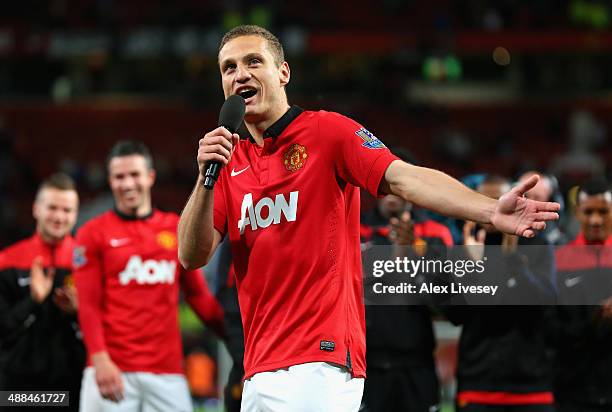 Nemanja Vidic of Manchester United speaks to the fans after his final home game for the club at the end of the Barclays Premier League match between...