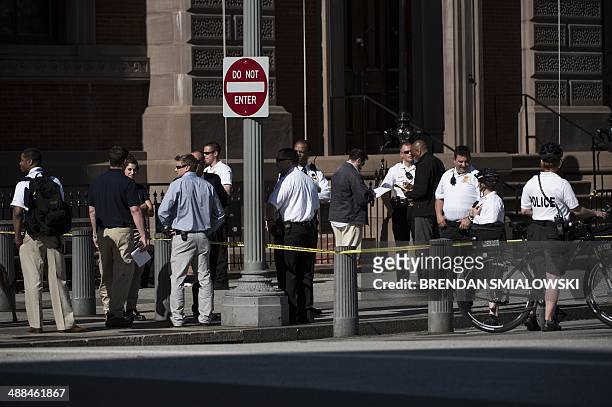Members of the Secret Service and other law enforcement gather on Pennsylvania Avenue near the White House May 6, 2014 in Washington, DC. The area...