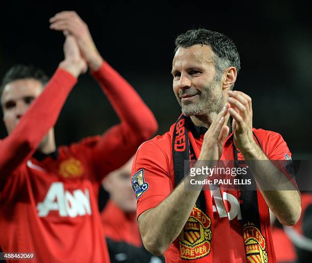 Manchester United's Interim Welsh player-manager Ryan Giggs applauds the supporters after the English Premier League football match between...