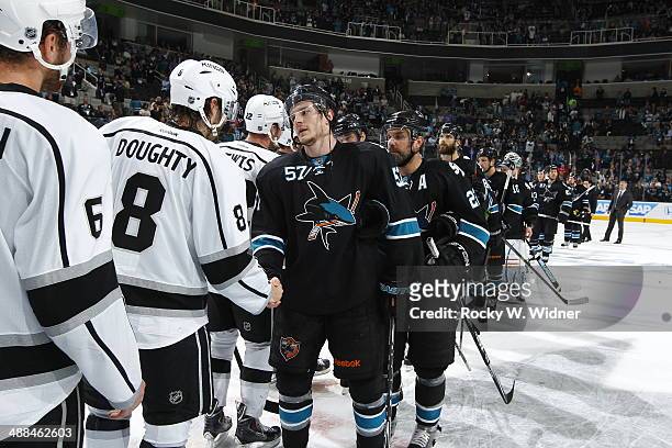 Tommy Wingels of the San Jose Sharks shakes hands with Drew Doughty of the Los Angeles Kings after being eliminated from the playoffs in Game Seven...