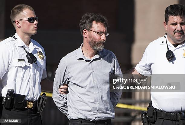 Man is taken into custody by Secret Service after a car ran a roadblock on Pennsylvania Avenue near the White House May 6, 2014 in Washington, DC....