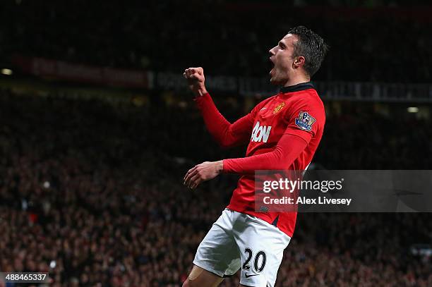 Robin van Persie of Manchester United celebrates scoring his team's third goal during the Barclays Premier League match between Manchester United and...