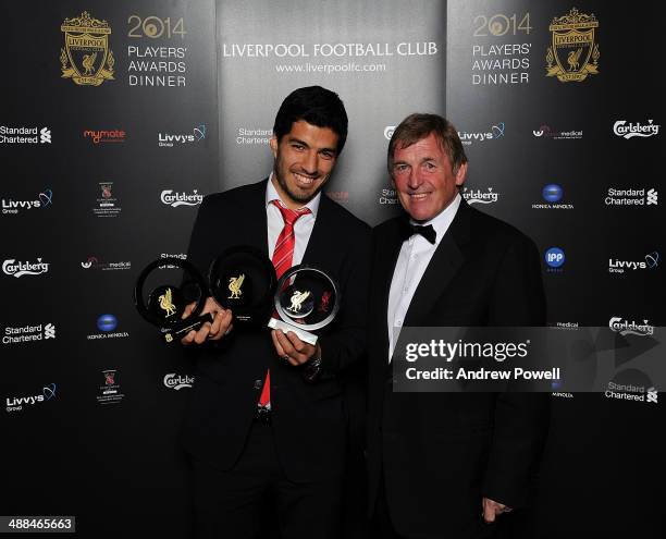 Kenny Dalglish of Liverpool poses with Luis Suarez of Liverpool who poses with Fans Player of the Year award, Goal of the season award and Players...