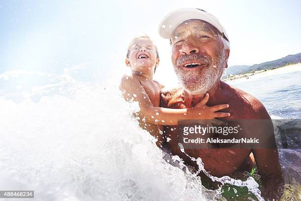 water fun - grandfather stock pictures, royalty-free photos & images