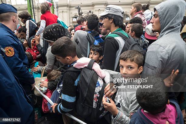 refugees in keleti train station budapest hungary - migrant crisis in europe stock pictures, royalty-free photos & images