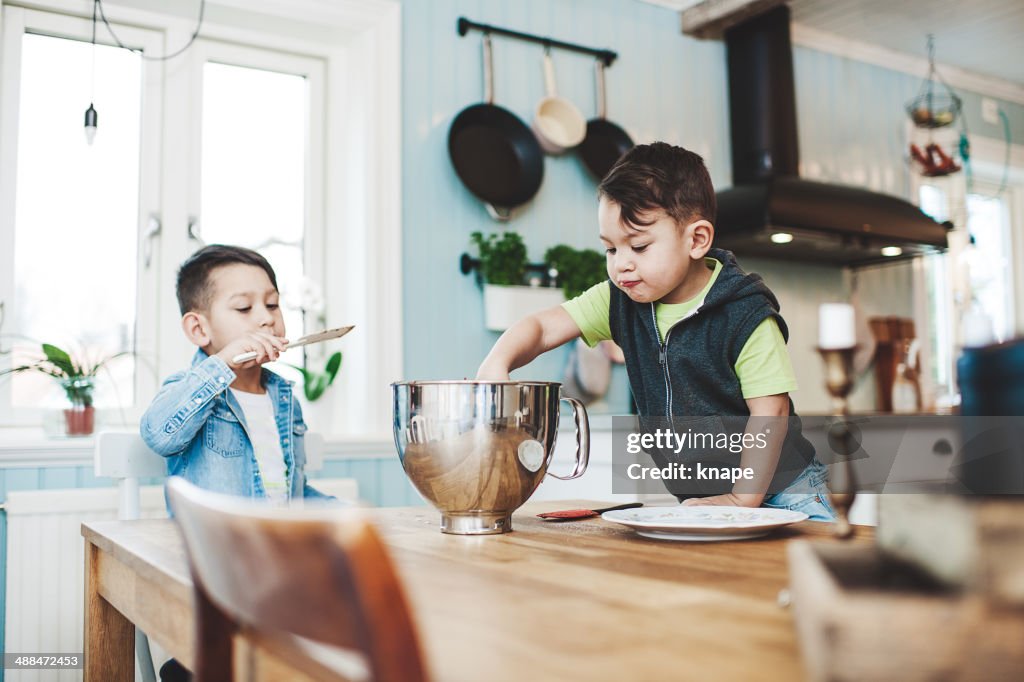 Small boys baking in the kitchen