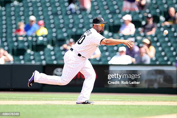 Wilin Rosario of the Colorado Rockies plays first base during the game against the Arizona Diamondbacks at Coors Field on September 1, 2015 in...