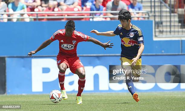Fabian Castillo of FC Dallas defends the ball against Kosuke Kimura of New York Red Bulls at Toyota Stadium in Frisco on May 4, 2014 in Frisco, Texas.