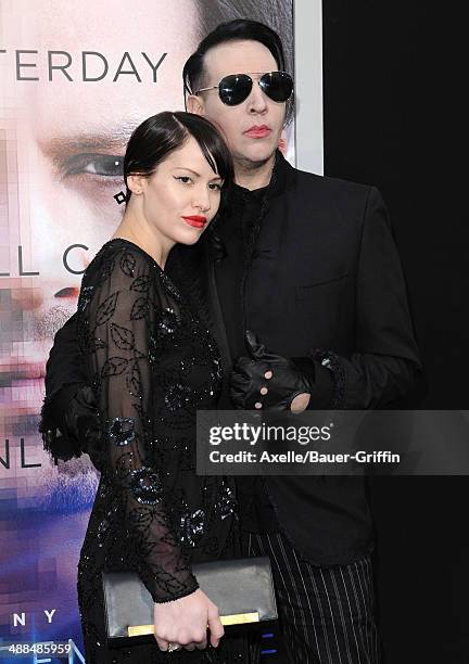 Musician Marilyn Manson and Lindsay Usich arrive at the Los Angeles premiere of 'Transcendence' at Regency Village Theatre on April 10, 2014 in...